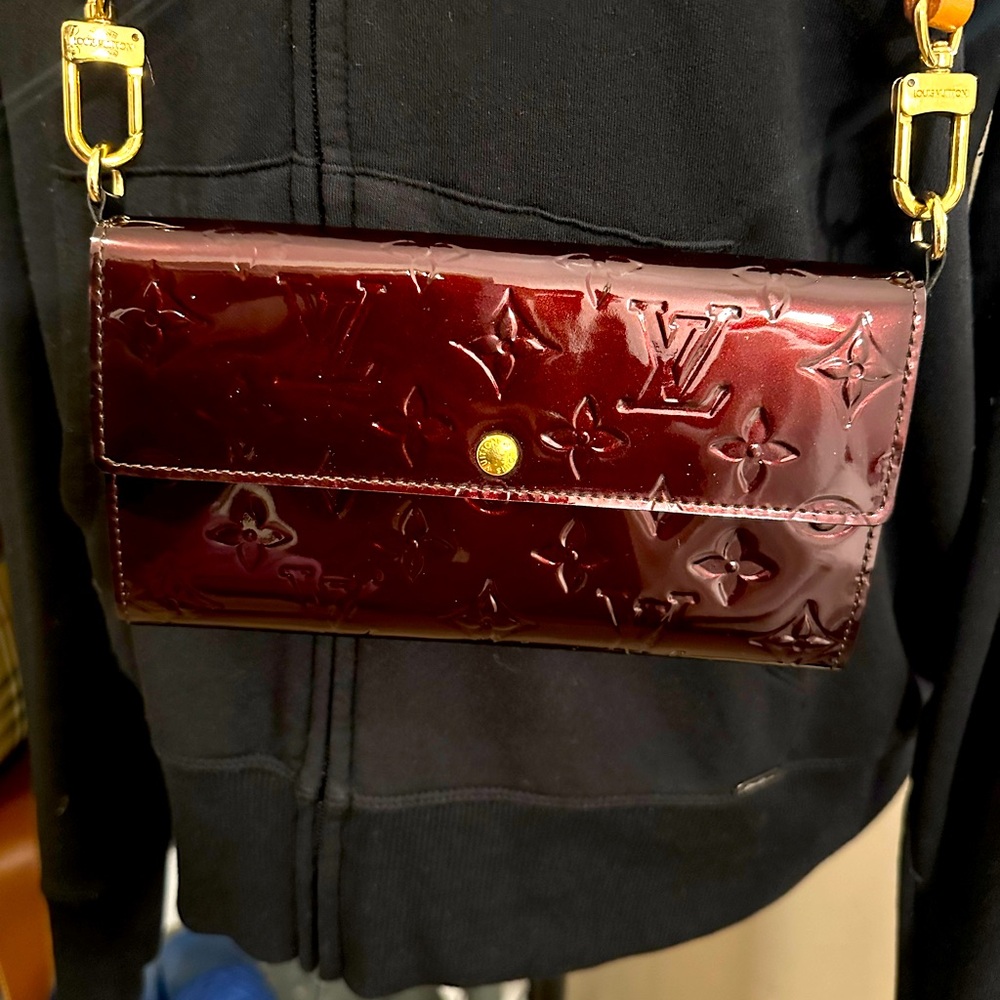 Louis Vuitton embossed burgundy wallet